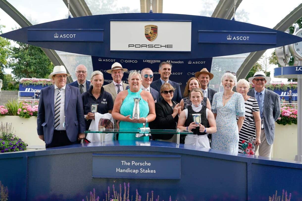 The winning owners of Tempus receive their prizes after winning at Ascot racecourse