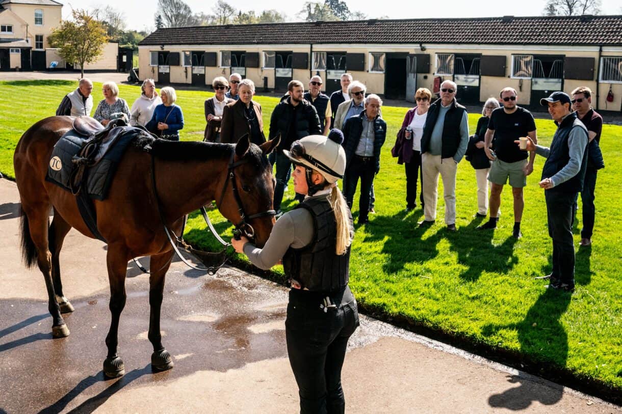 Tom Clover with Hambleton Racing owners in Newmarket