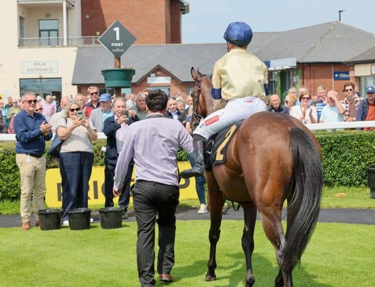 Hollie Doyle returns to the winners Enclosure on Dapper Charm