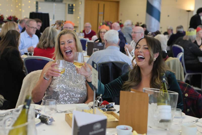 Hambleton Racing guests enjoying themselves at a Christmas social event.