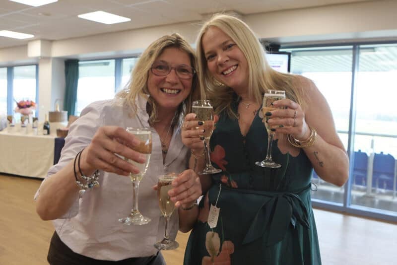 Owners raising glasses at the reception during Doncaster Owners Day