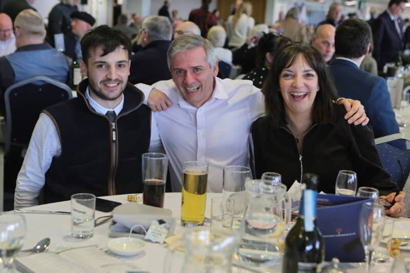 Hambleton Racing owners seated together at a table during Doncaster Owners Day