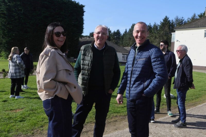 Owners enjoying a Hambleton Racing stables event at Karl Burke's yard in the sun