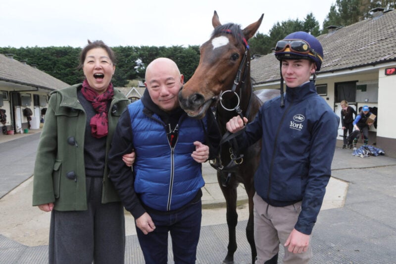 Owners have their photo taken with their horse at a Hambleton Racing event