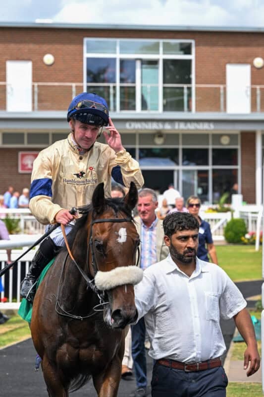 Racehorse Kodiak Breeze returns to the winners enclosure at Thirsk.