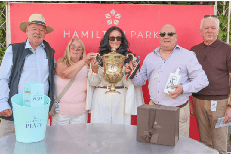 winning racehorse owners receive their prize at Hamilton racecourse